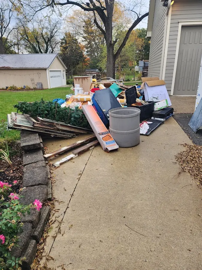 Dumpster being loaded with debris for Commercial Dumpster Rental in Cloverleaf